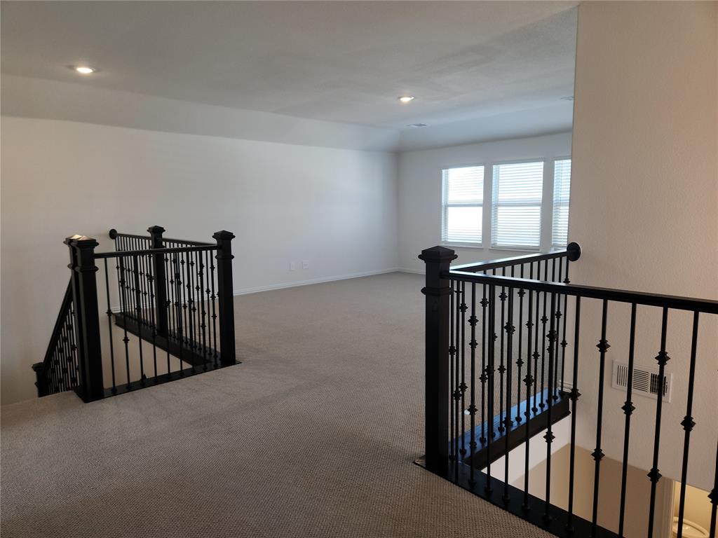 2433 Glacier Ridge Corinth, TX 76210 - Photo 30 of 40 a view of hallway with stairs and a window