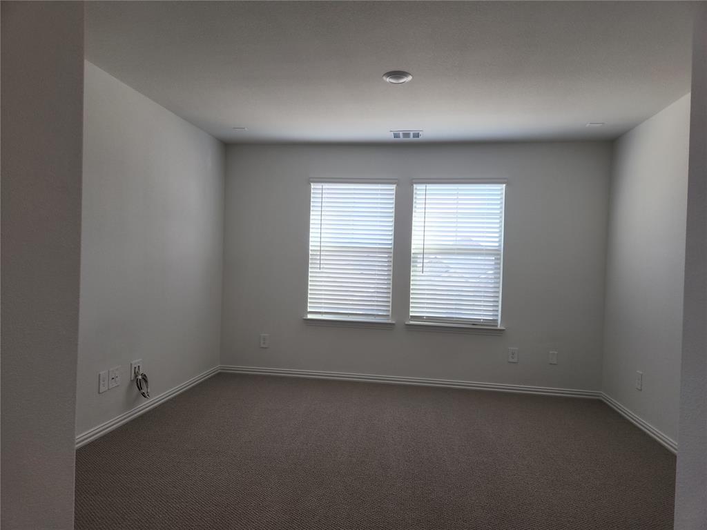 2433 Glacier Ridge Corinth, TX 76210 - Photo 32 of 40 an empty room with a window