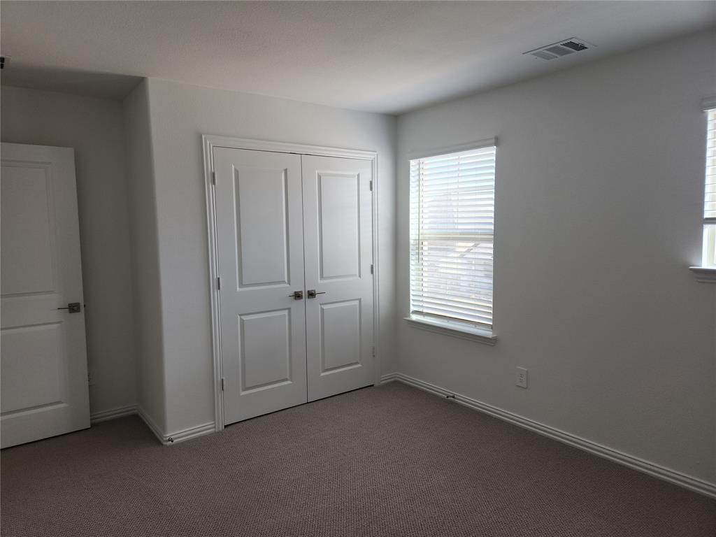 2433 Glacier Ridge Corinth, TX 76210 - Photo 35 of 40 a view of an empty room with a window
