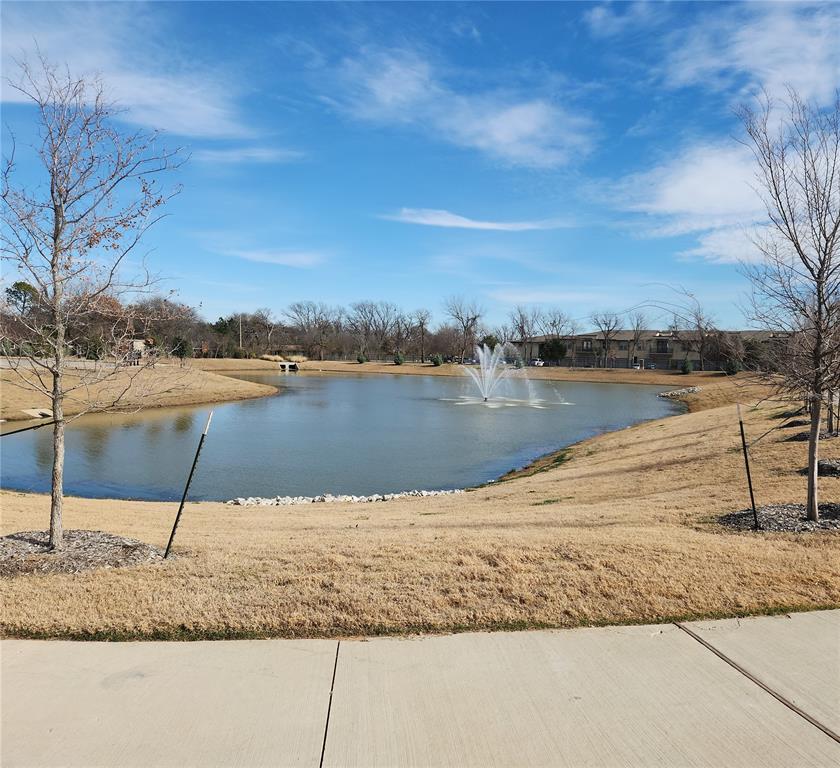 2433 Glacier Ridge Corinth, TX 76210 - Photo 39 of 40 a view of a lake with a mountain in the background