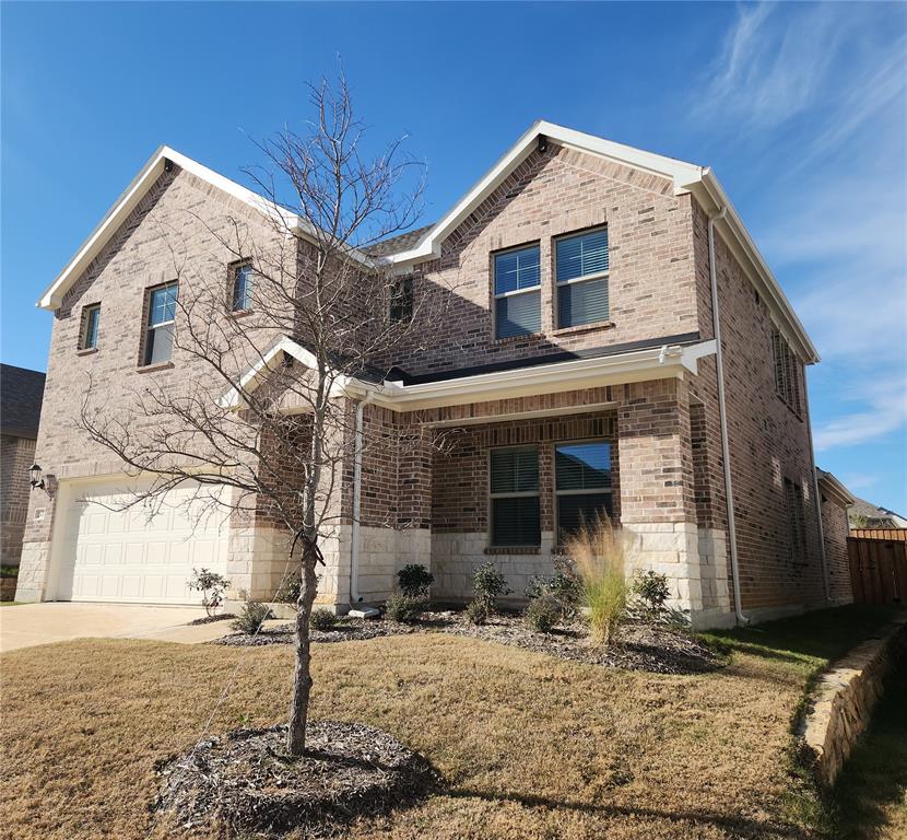 2433 Glacier Ridge Corinth, TX 76210 - Photo 4 of 40 a front view of a house with yard