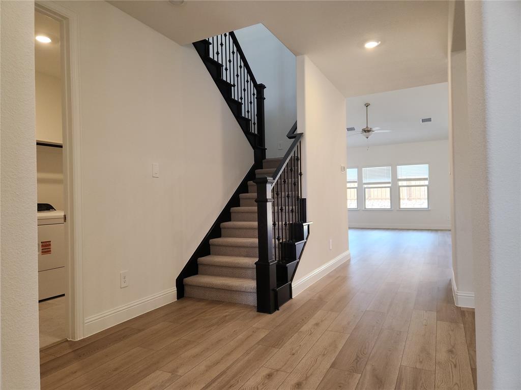 2433 Glacier Ridge Corinth, TX 76210 - Photo 9 of 40 a view of an entryway with wooden floor