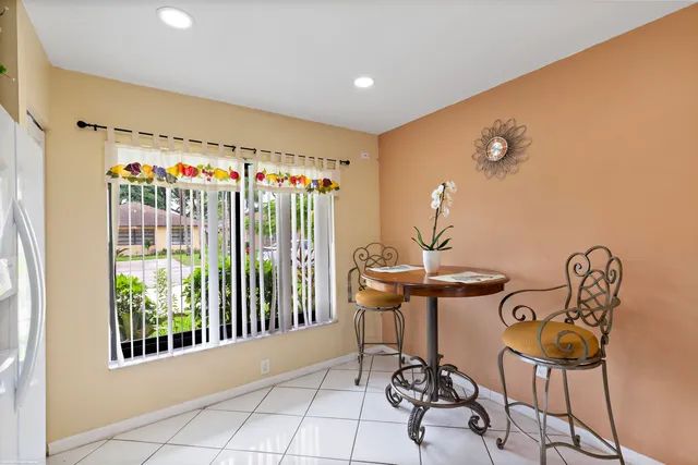 a view of a chairs and table in a room