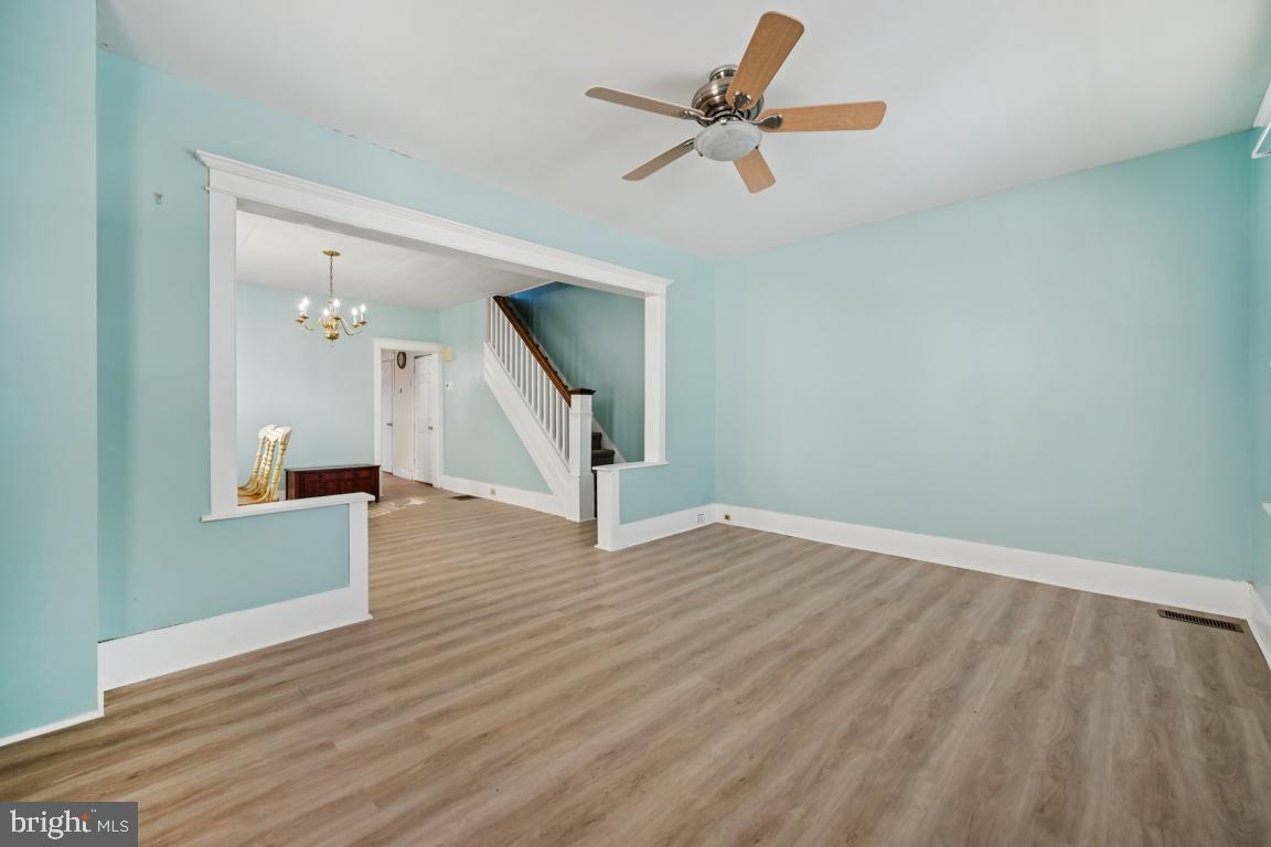 525 Bridgeboro Street Riverside, NJ 08075 - Photo 2 of 16 wooden floor in an empty room with a window