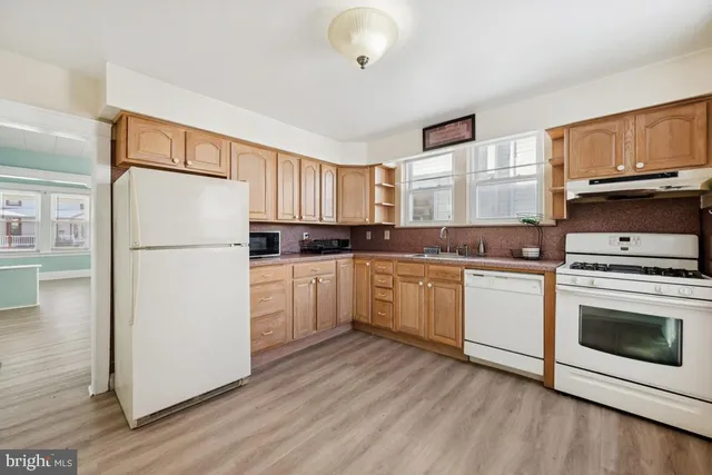 a white toilet sitting next to a bathroom sink