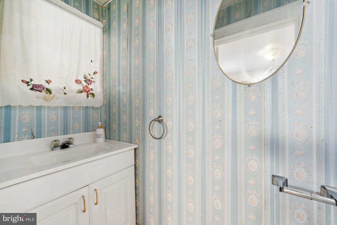 525 Bridgeboro Street Riverside, NJ 08075 - Photo 7 of 16 a bathroom with a sink and mirror
