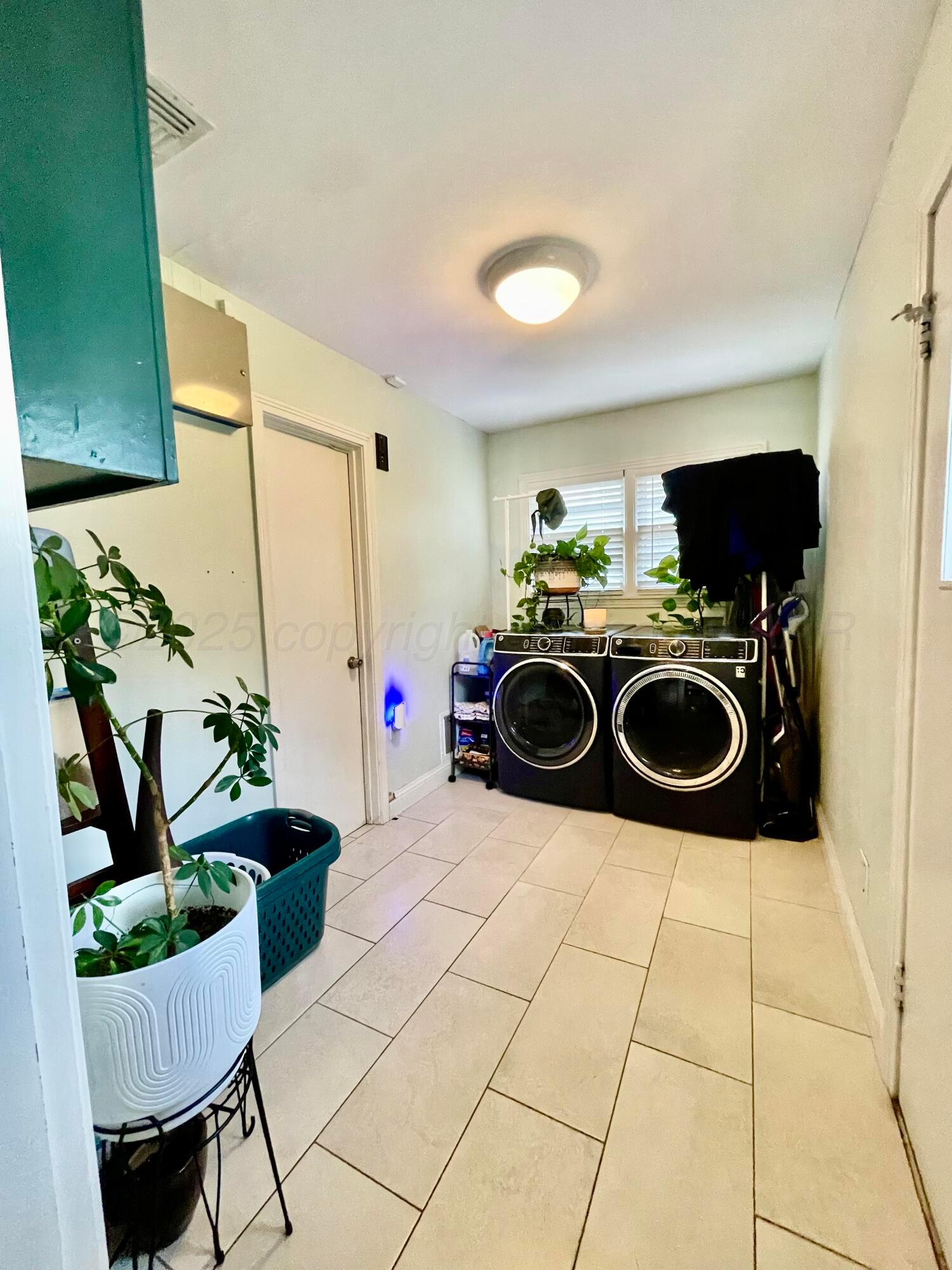 2406 Juniper Drive Amarillo, TX 79109 - Photo 14 of 28 a kitchen with a stove and a microwave