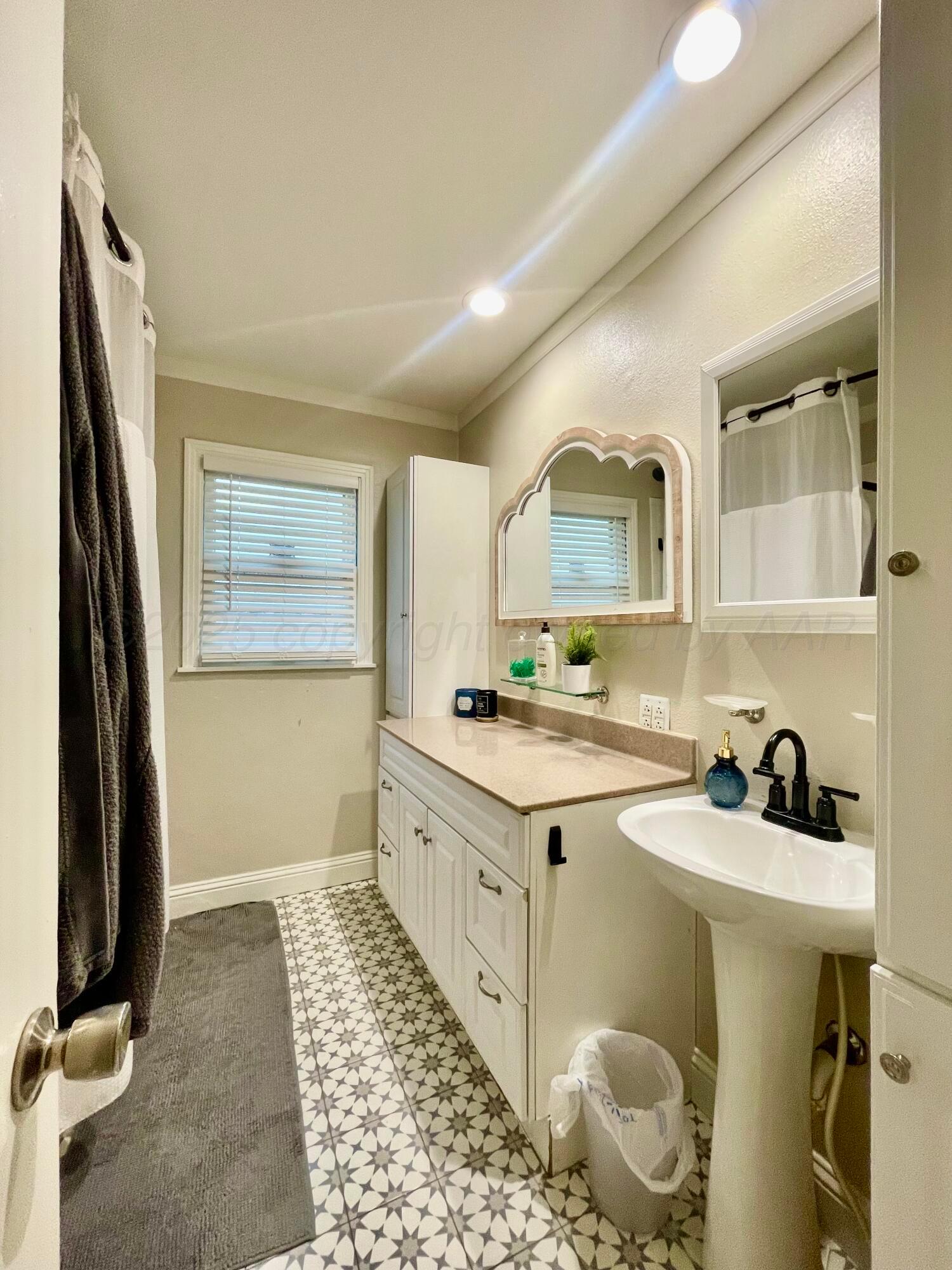 2406 Juniper Drive Amarillo, TX 79109 - Photo 19 of 28 a kitchen with a sink cabinets and appliances