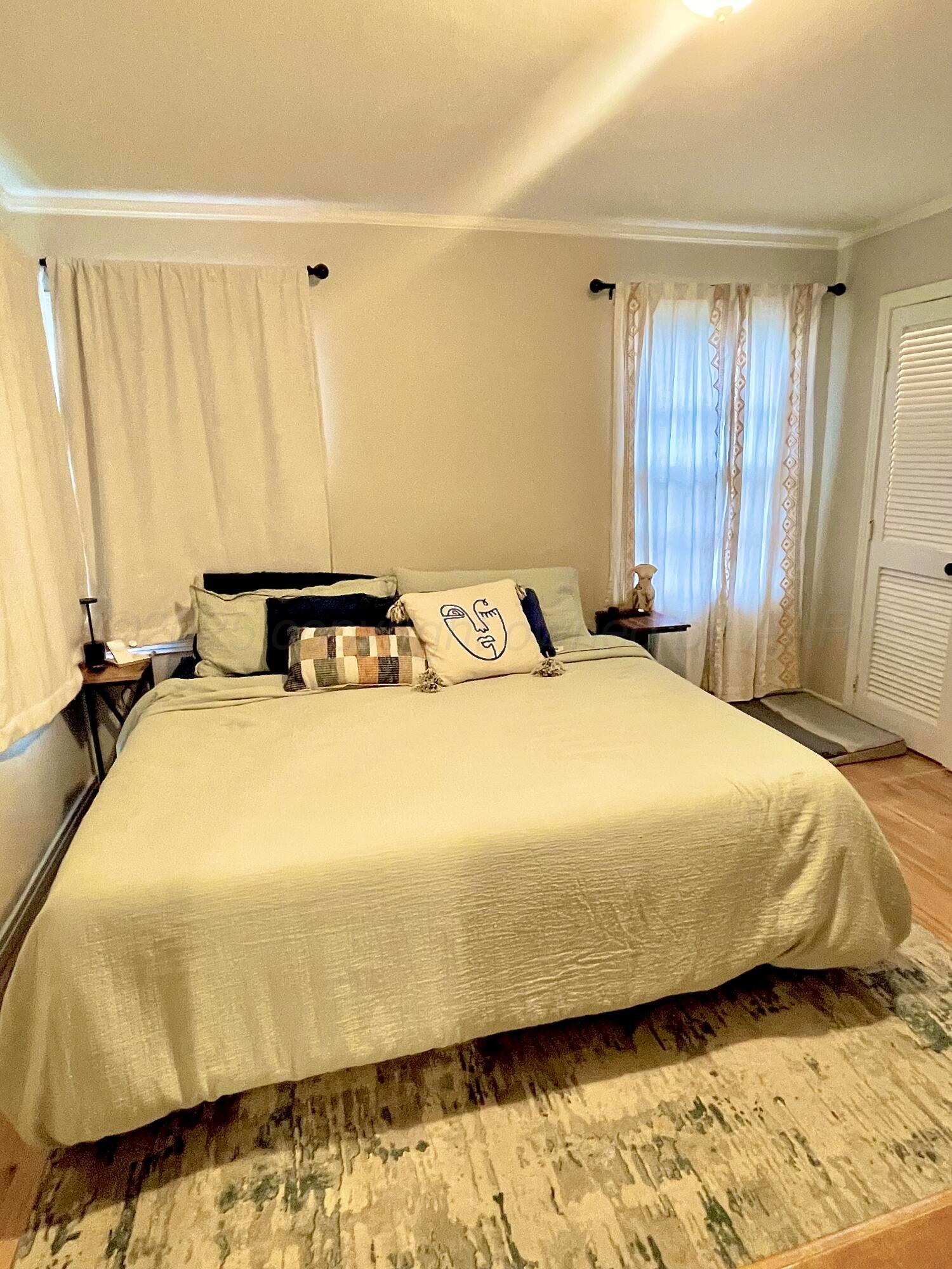 2406 Juniper Drive Amarillo, TX 79109 - Photo 21 of 28 a bedroom with a bed and curtain