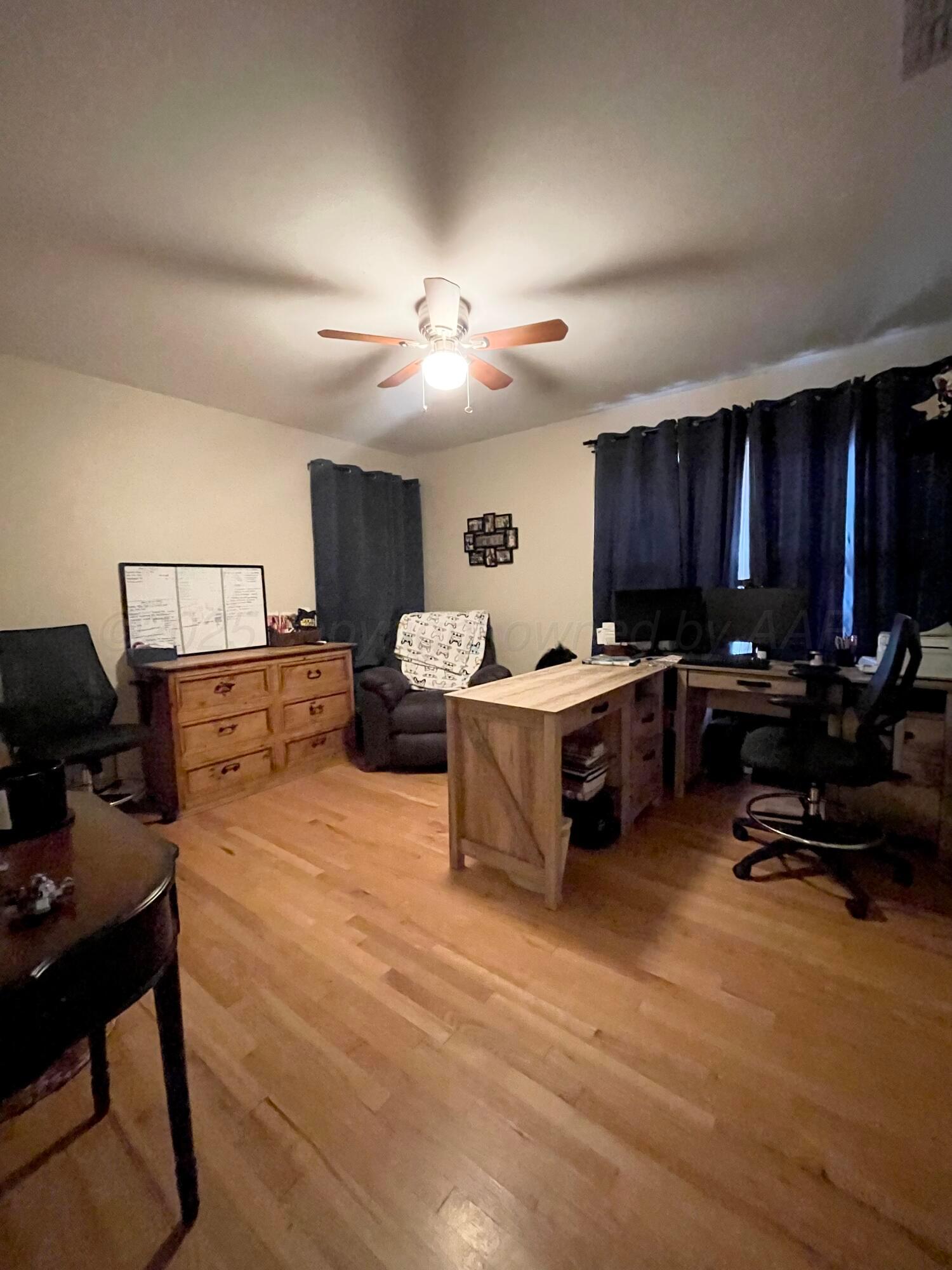 2406 Juniper Drive Amarillo, TX 79109 - Photo 22 of 28 a living room with furniture kitchen view and a chandelier