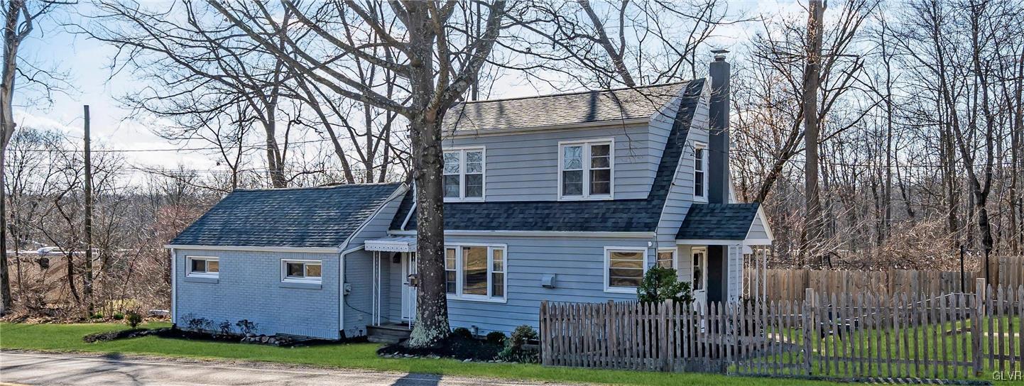 975 State Park Road Wind Gap, PA 18091 - Photo 2 of 17 a front view of a house with garden