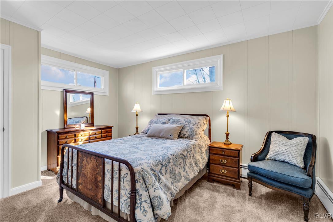 975 State Park Road Wind Gap, PA 18091 - Photo 9 of 17 a bedroom with a bed and a lamp on table