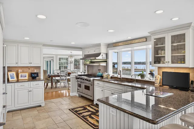 a bed room with a bed and a large window