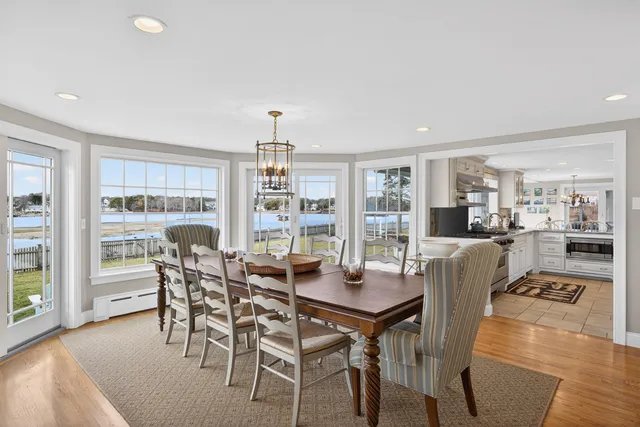a view of a house with swimming pool and sitting area