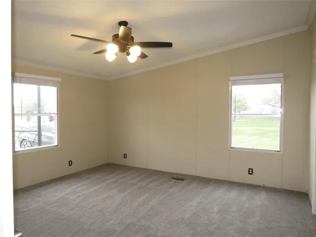a view of an empty room with a window