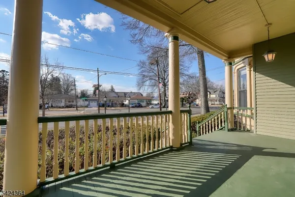 a view of a balcony with wooden floor