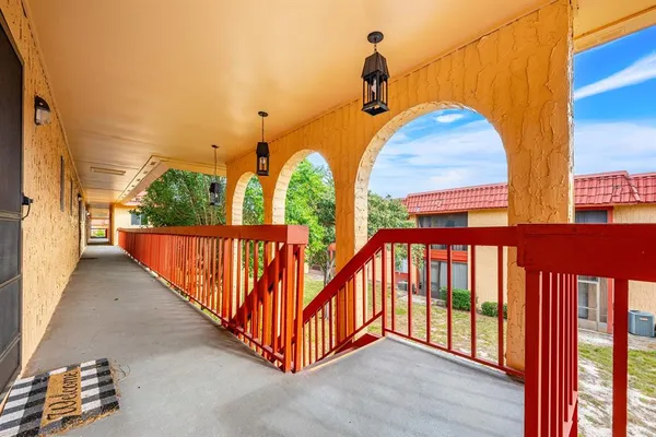 a view of a brick house with a street