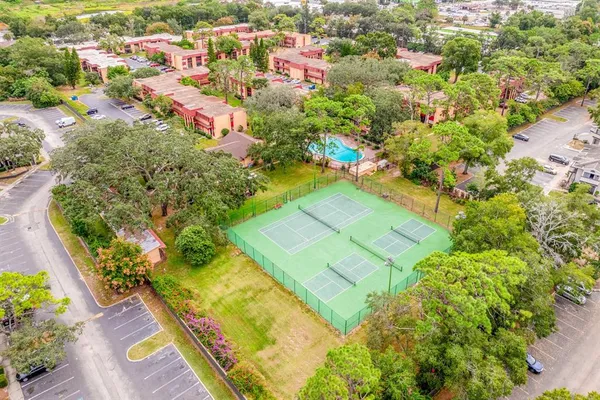 an aerial view of residential houses with outdoor space