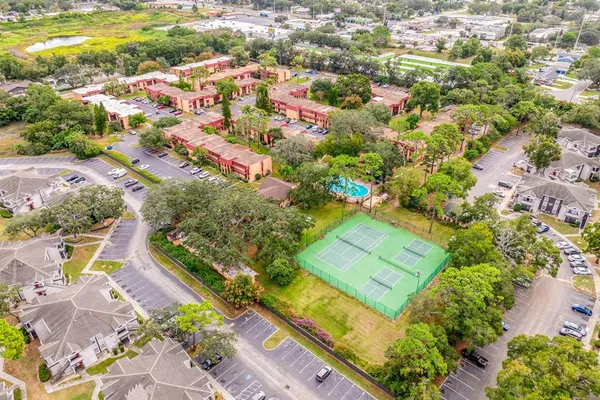 an aerial view of residential houses with outdoor space