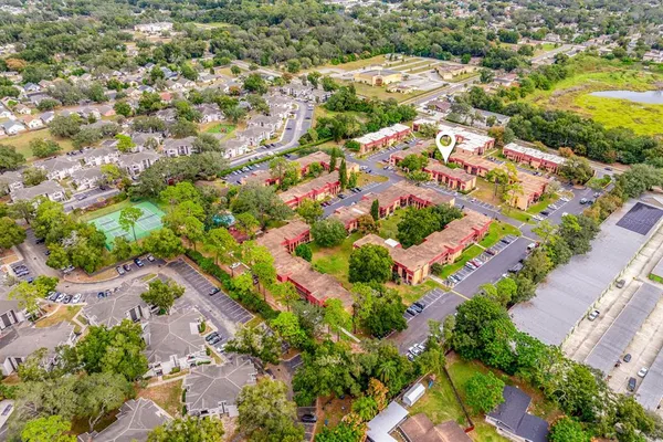 an aerial view of residential houses with outdoor space
