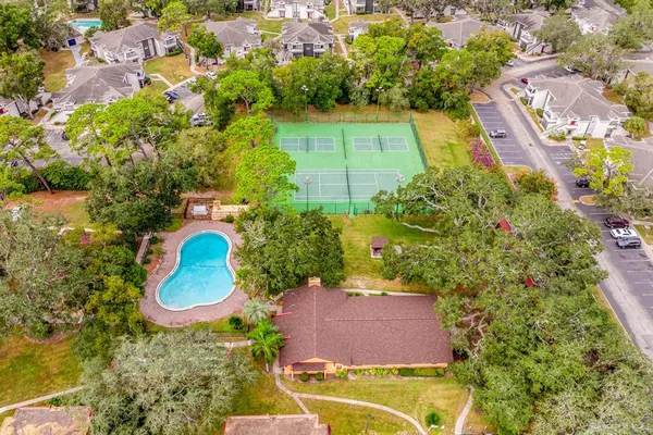 an aerial view of residential houses with outdoor space