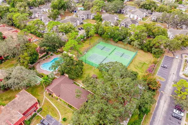 an aerial view of residential houses with outdoor space