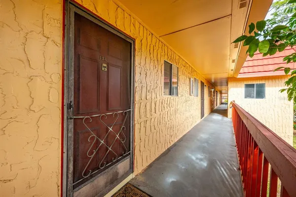 a kitchen with cabinets stainless steel appliances and a sink