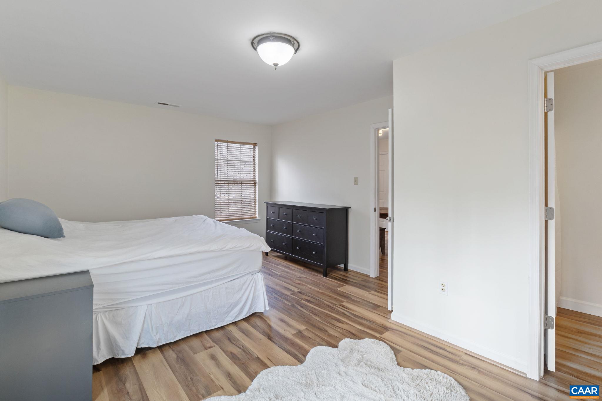 473 Larkspur Road Ruckersville, VA 22968 - Photo 12 of 28 a bedroom with a bed and a dresser