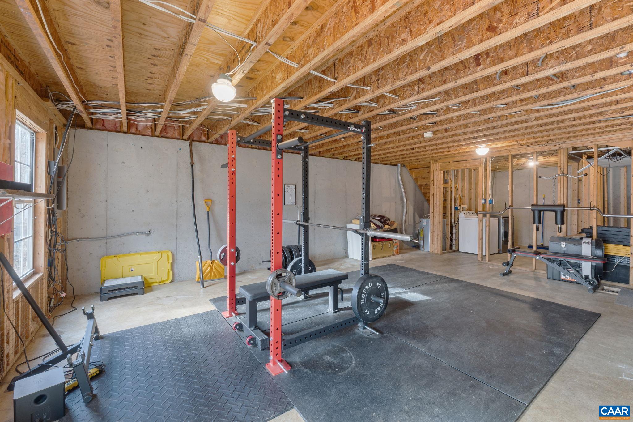 473 Larkspur Road Ruckersville, VA 22968 - Photo 19 of 28 a view of a room with gym equipment