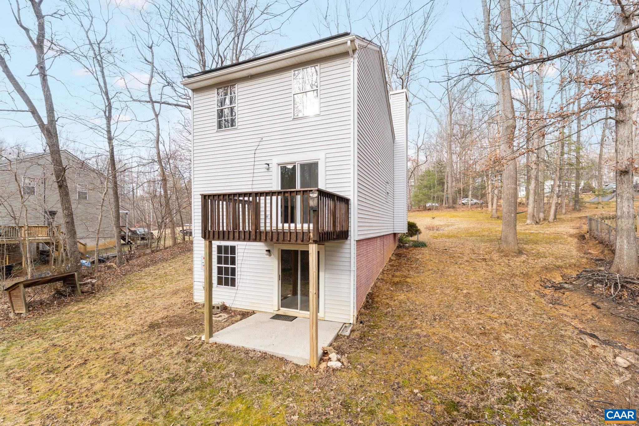 473 Larkspur Road Ruckersville, VA 22968 - Photo 26 of 28 a view of a house with a yard covered in snow