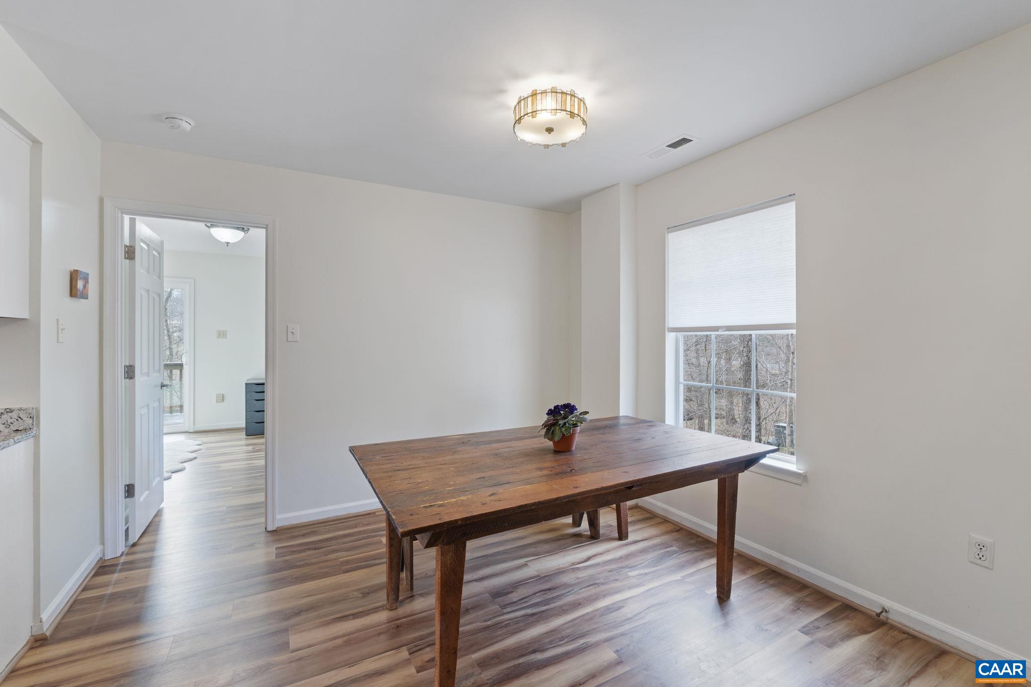 473 Larkspur Road Ruckersville, VA 22968 - Photo 8 of 28 a view of a workspace with furniture and a window