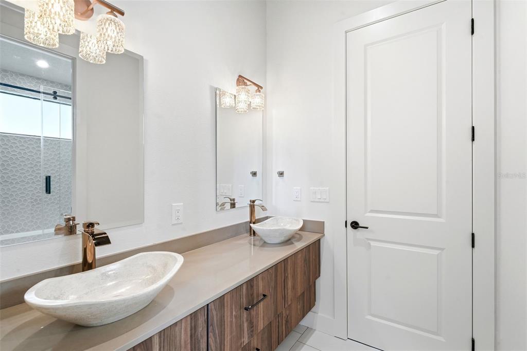 1615 Cole Road Orlando, FL 32803 - Photo 26 of 31 a bathroom with a sink and a mirror