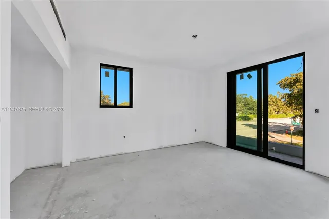 a view of empty room with floor to ceiling window