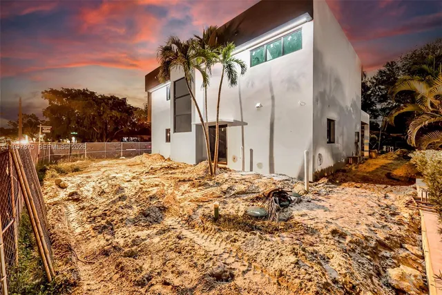 a view of a house with a snow on the ground
