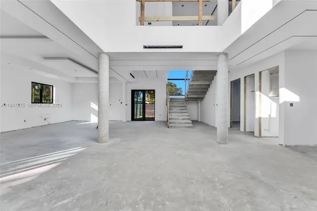a view of a livingroom with an empty space and window