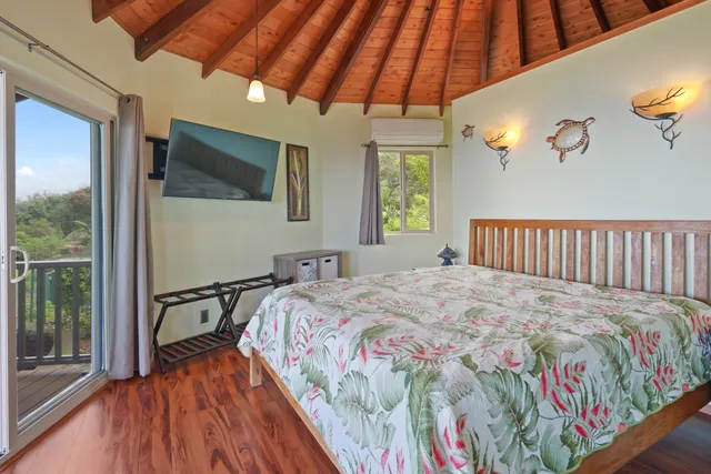 a bedroom with a bed and a mirror