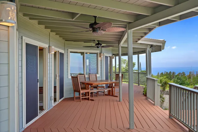a view of a patio with a table chairs and a patio
