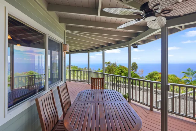 a view of balcony with wooden floor