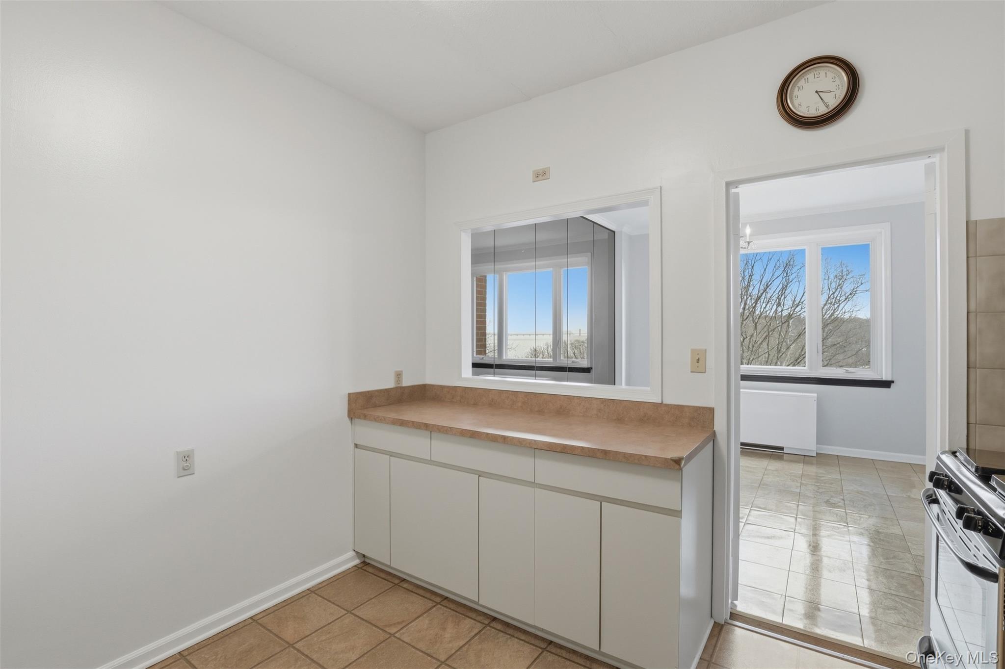 16 Rockledge Avenue, Unit 2C1 Ossining, NY 10562 - Photo 13 of 48 a room with a sink and a mirror