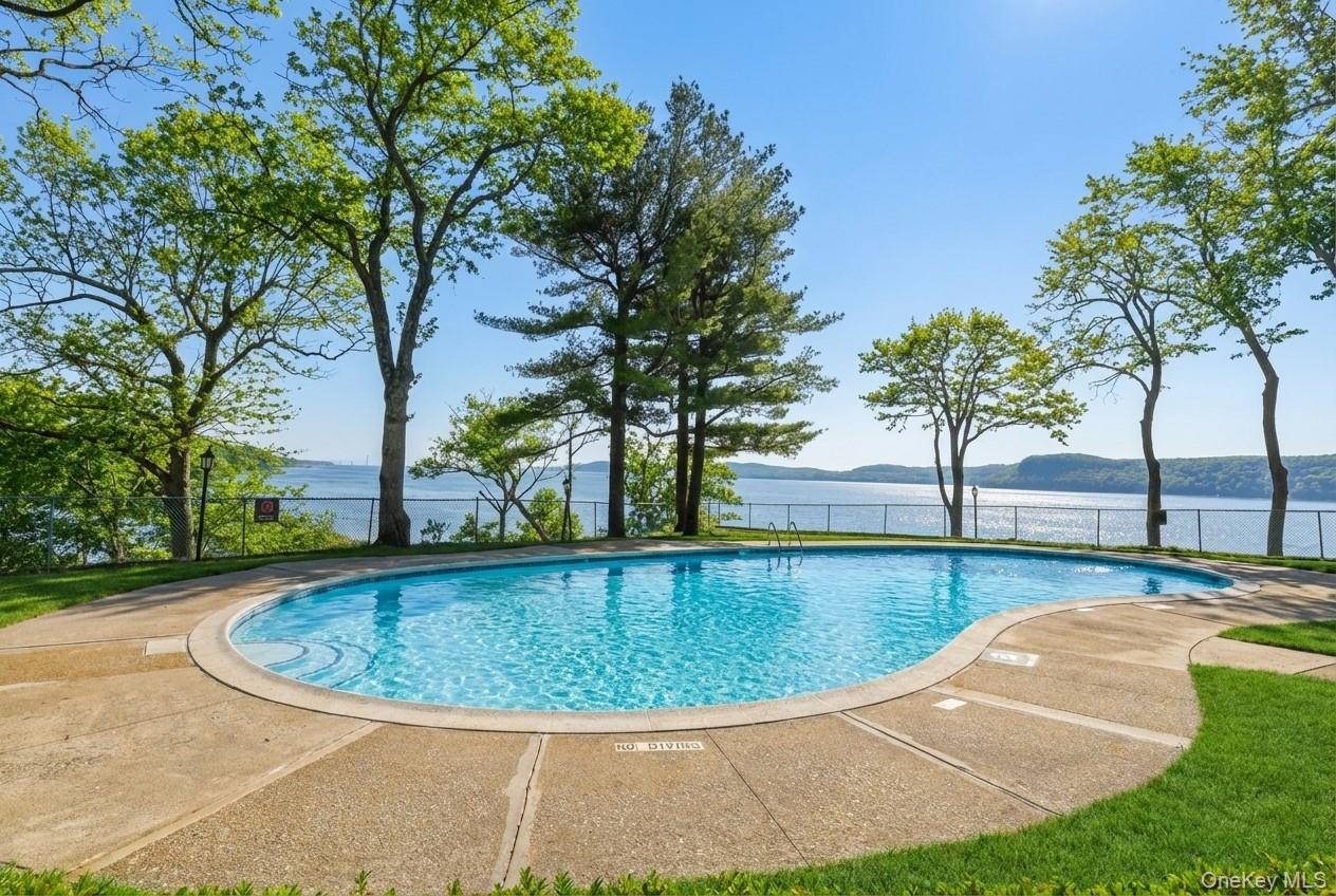 16 Rockledge Avenue, Unit 2C1 Ossining, NY 10562 - Photo 26 of 48 a view of a swimming pool with a yard