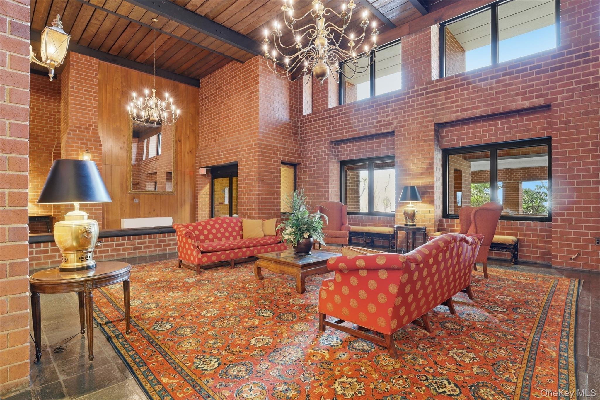 16 Rockledge Avenue, Unit 2C1 Ossining, NY 10562 - Photo 30 of 48 a view of a patio with couches chairs and wooden floor