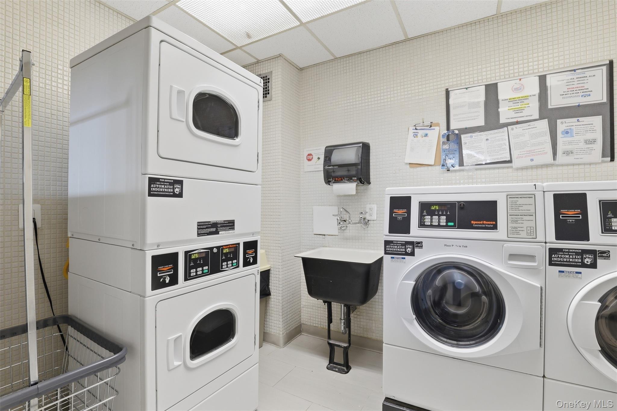 16 Rockledge Avenue, Unit 2C1 Ossining, NY 10562 - Photo 31 of 48 a utility room with dryer washer and a view of kitchen