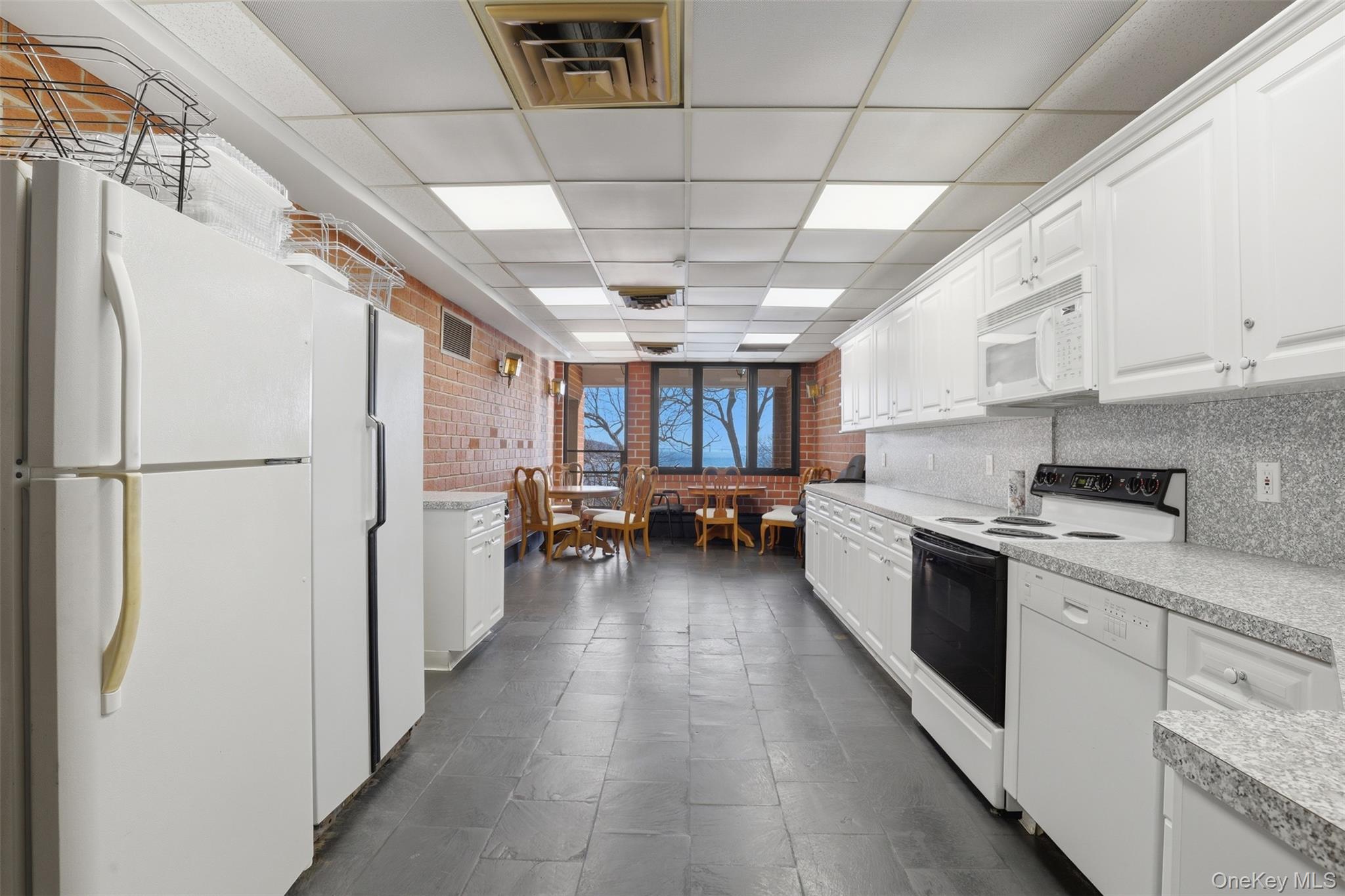 16 Rockledge Avenue, Unit 2C1 Ossining, NY 10562 - Photo 39 of 48 a kitchen with refrigerator and cabinets