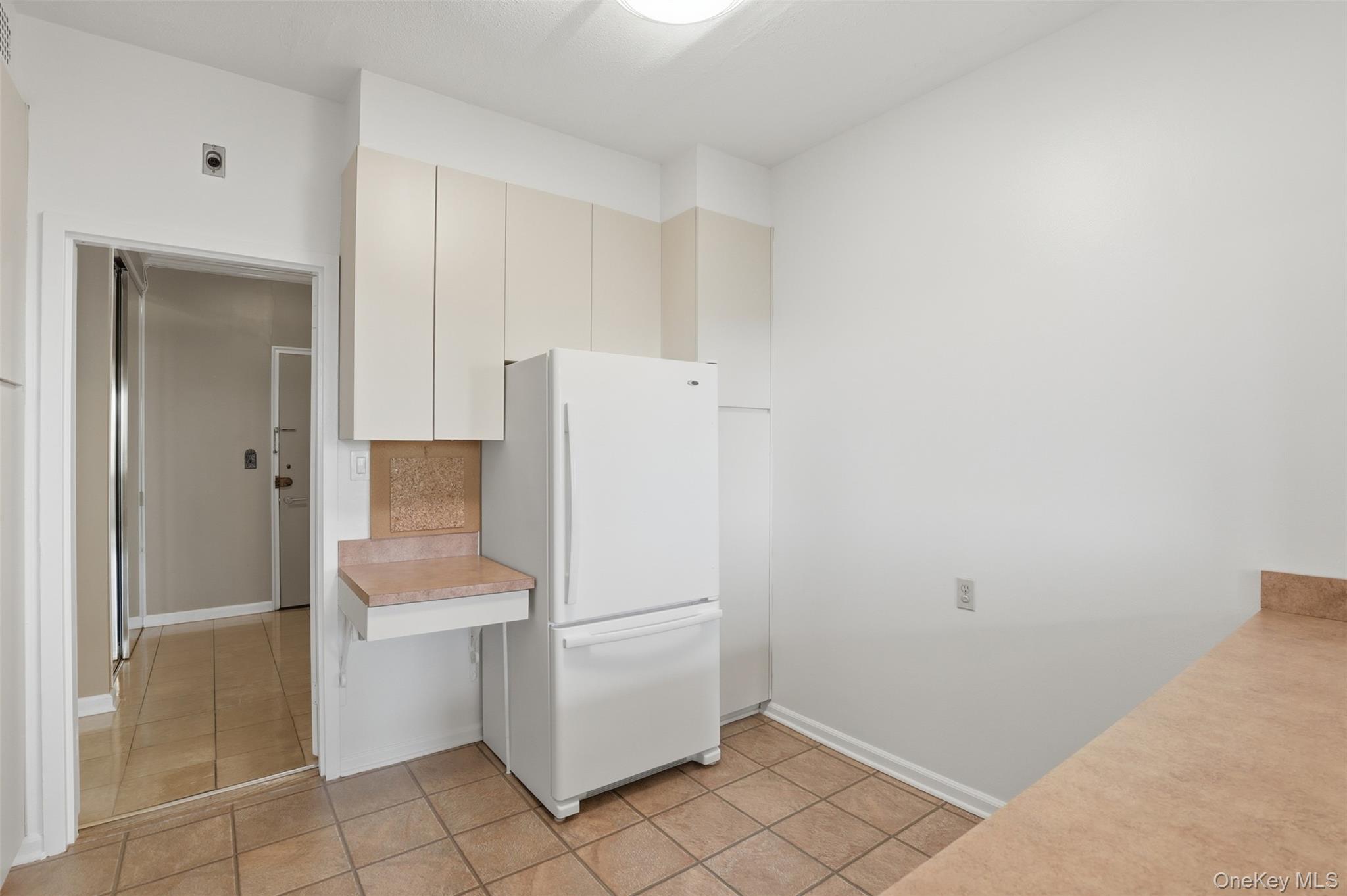 16 Rockledge Avenue, Unit 2C1 Ossining, NY 10562 - Photo 10 of 48 a utility room with cabinets washer and dryer