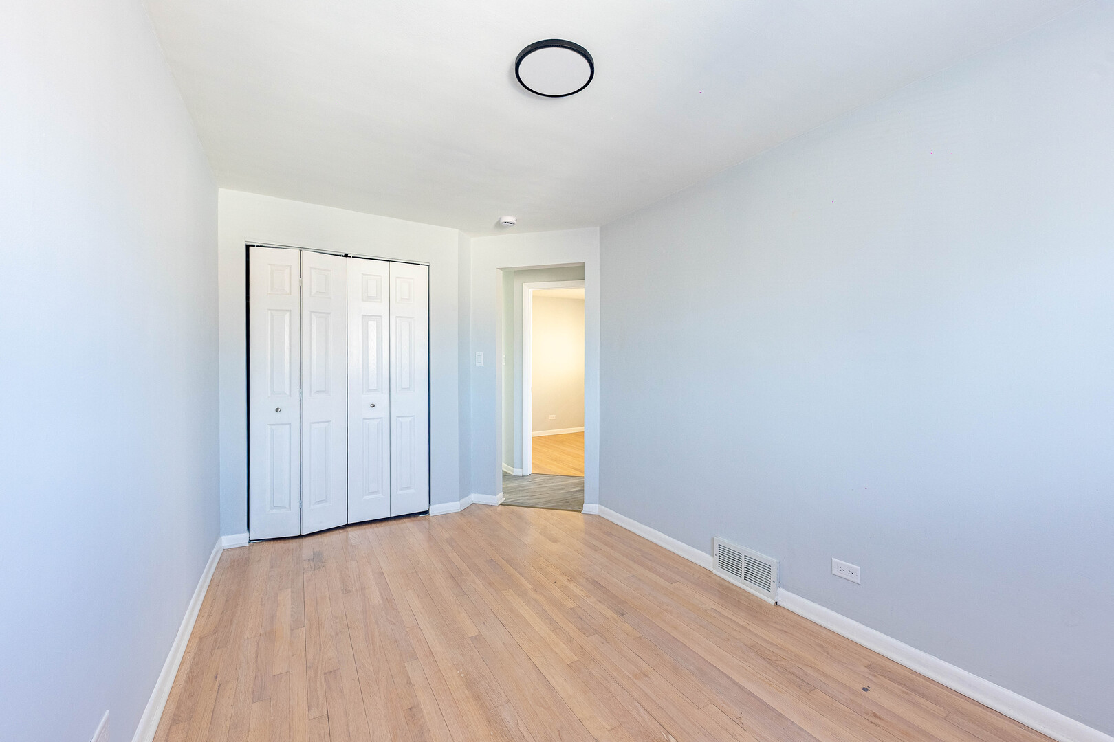4914 West 32nd Place, Unit 2 Cicero, IL 60804 - Photo 12 of 26 a view of a room with wooden floor and glass doors