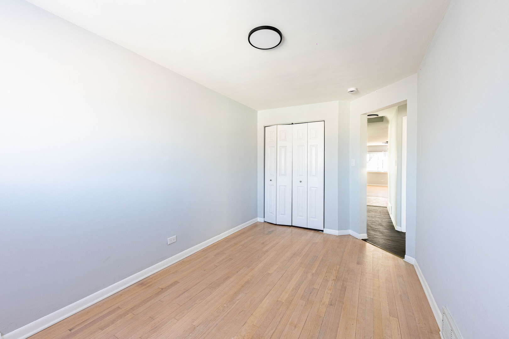 4914 West 32nd Place, Unit 2 Cicero, IL 60804 - Photo 13 of 26 a view of a room with wooden floor and bathroom