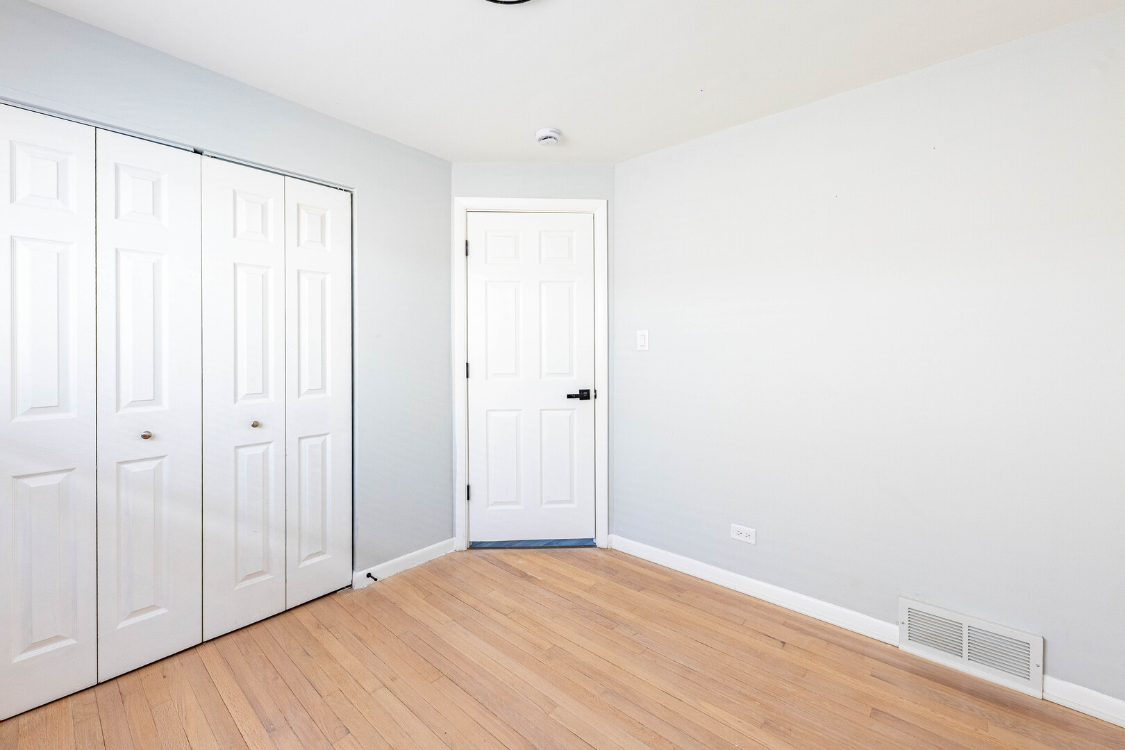 4914 West 32nd Place, Unit 2 Cicero, IL 60804 - Photo 18 of 26 a view of an empty room with wooden floor