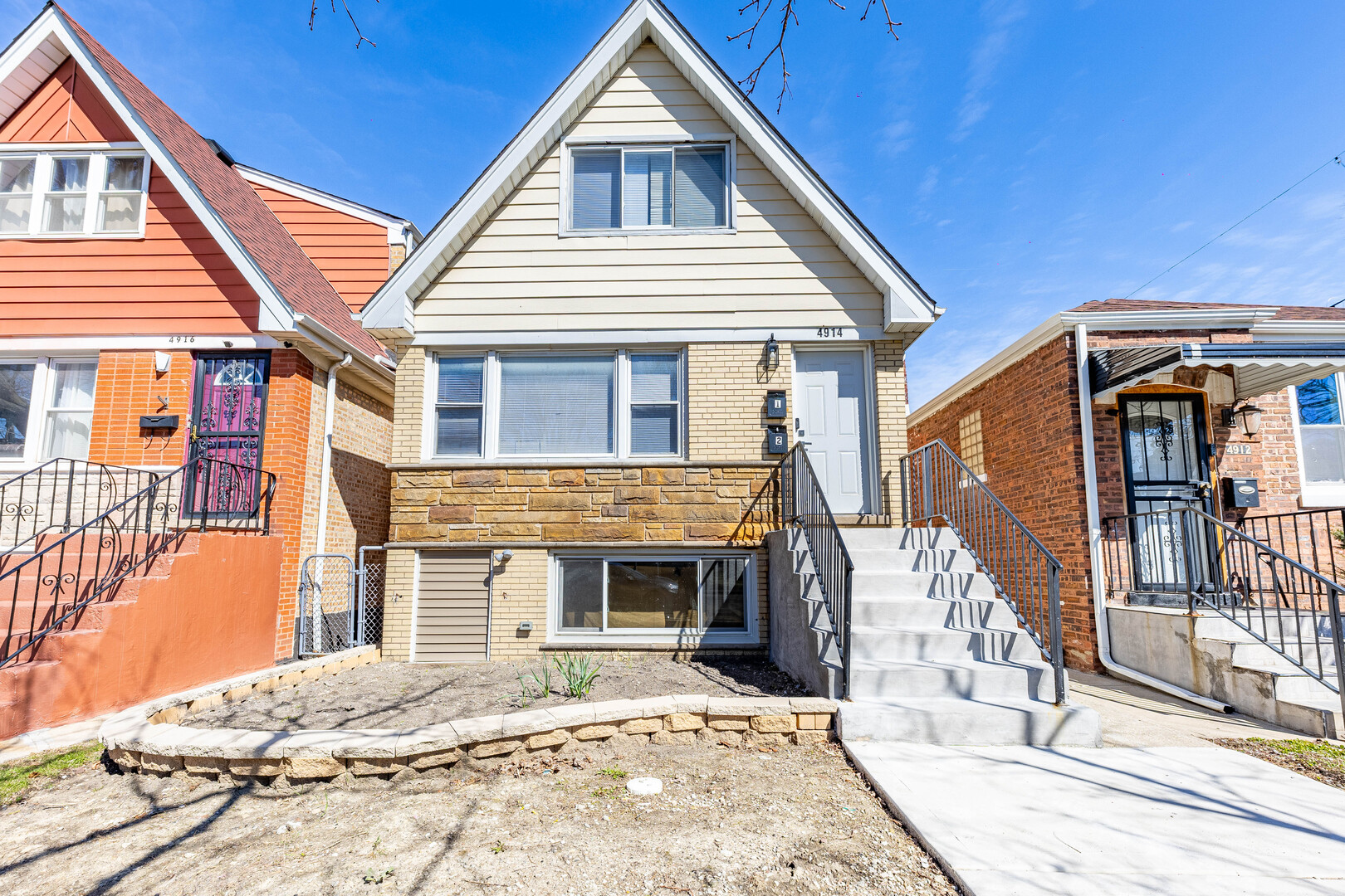 4914 West 32nd Place, Unit 2 Cicero, IL 60804 - Photo 2 of 26 a front view of a house with a yard