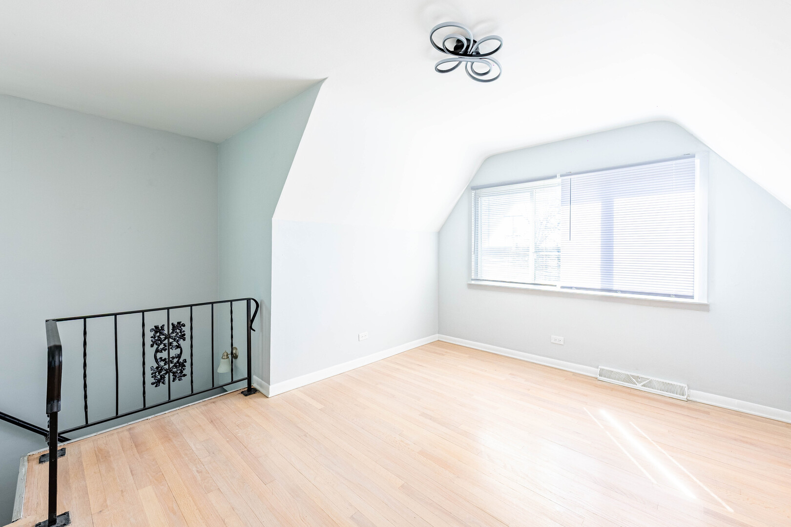 4914 West 32nd Place, Unit 2 Cicero, IL 60804 - Photo 21 of 26 a view of a room with wooden floor and windows