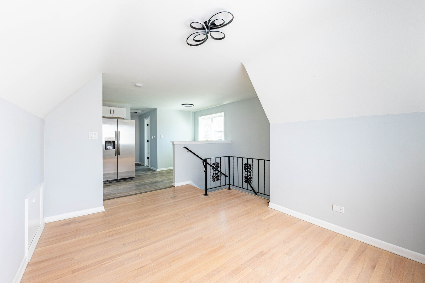 4914 West 32nd Place, Unit 2 Cicero, IL 60804 - Photo 5 of 26 a view of a hallway with wooden floor and a bathroom